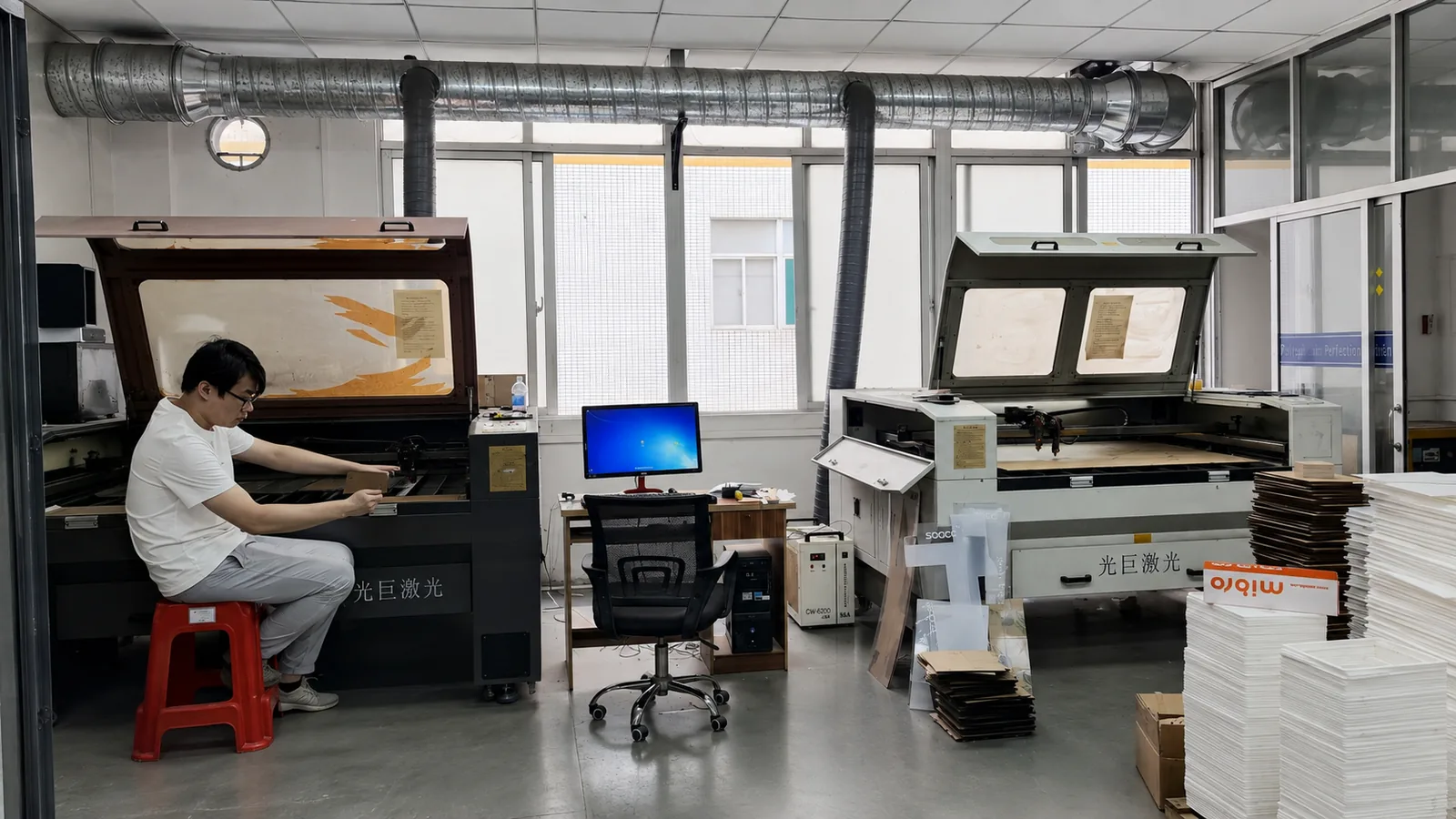 Laser cutting acrylic sheets in a Dongguan workshop